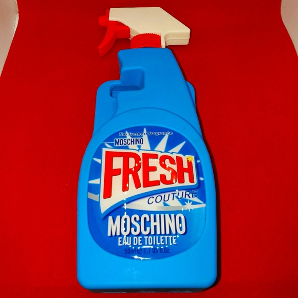 Moschino funny spray cleaner cell phone holder